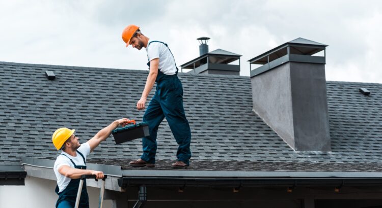 Indianapolis roofer performing a roof inspection to assess damage and repair needs.