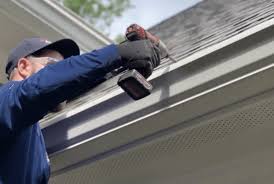 Professional roofer inspecting a roof in Indianapolis for proper hiring guidance.